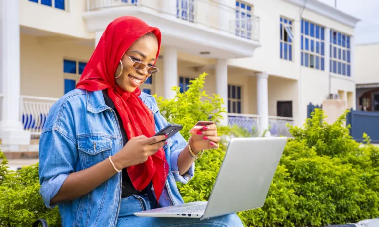 A girl shopping trying to know How Much Does a Website Cost in Nigeria